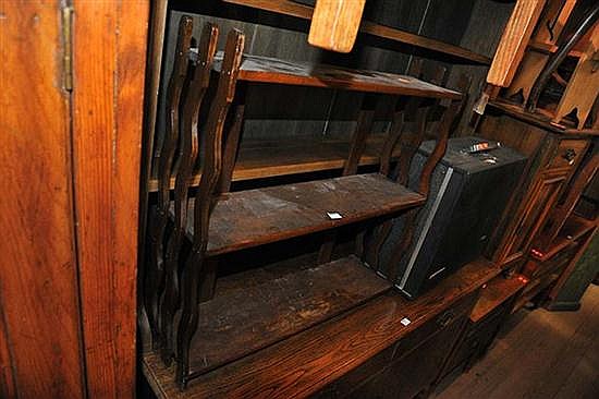 A WALL MOUNTED SHELVING UNIT