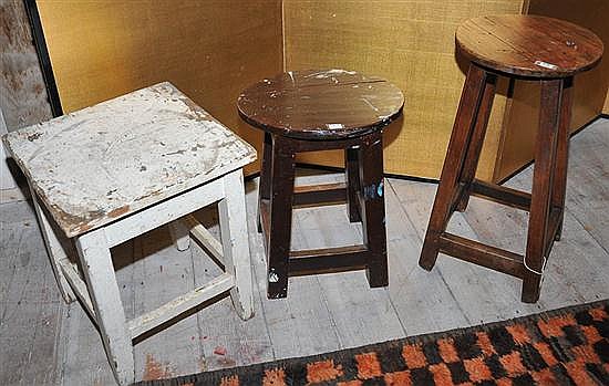 THREE RUSTIC WOODEN STOOLS