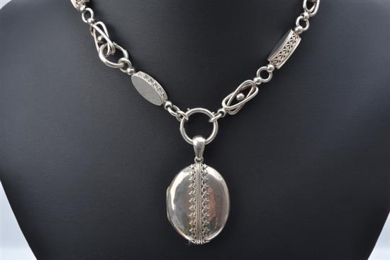 A STERLING SILVER LOCKET AND CHAIN