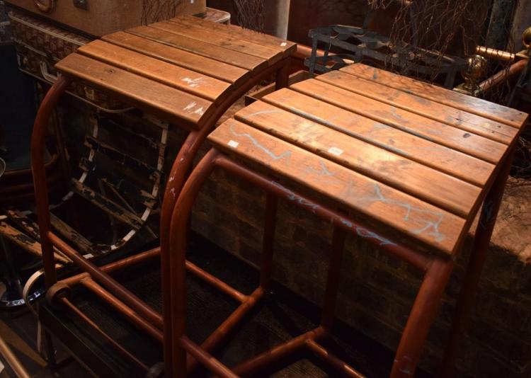 A PAIR OF RUSTIC METAL STOOLS