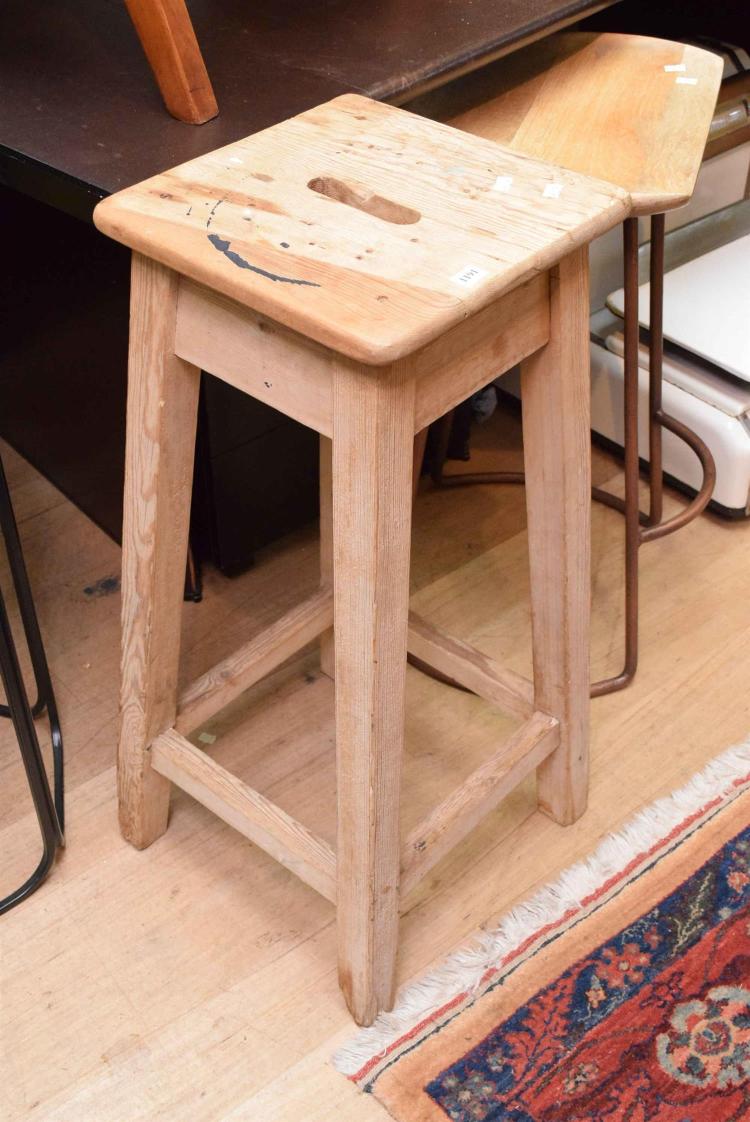 A RUSTIC WOODEN STOOL
