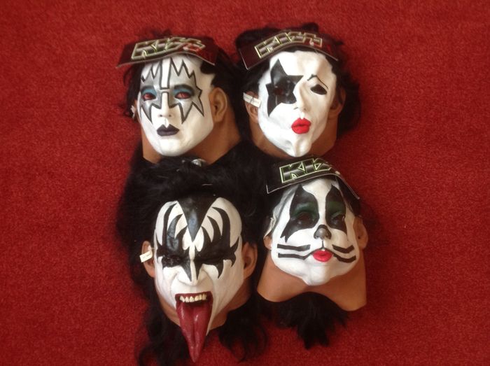 Four rubber Kiss masks
