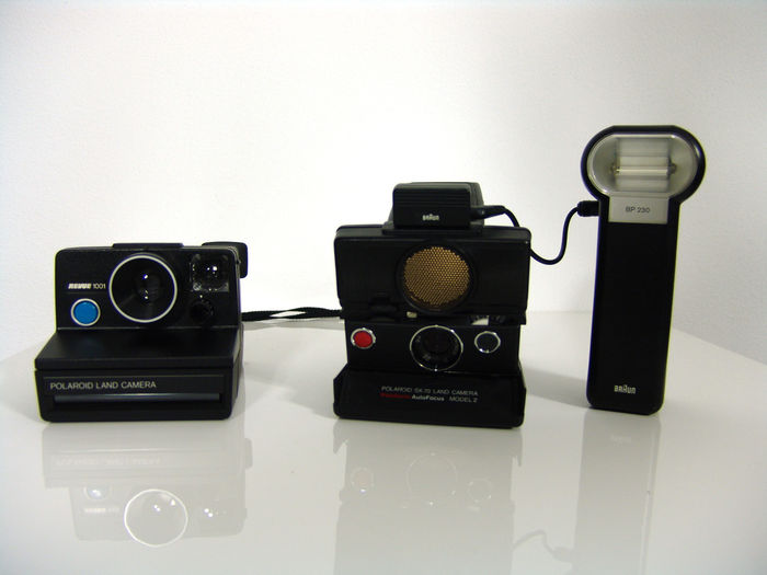 Polaroid SX-70 folding instant camera with leather eveready case - Braun BP230 electronic flash for SX-70 - Polaroid Revue 1001 instant camera 1976