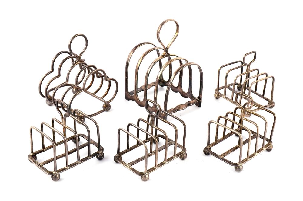 A set of four Edwardian sterling silver toast racks