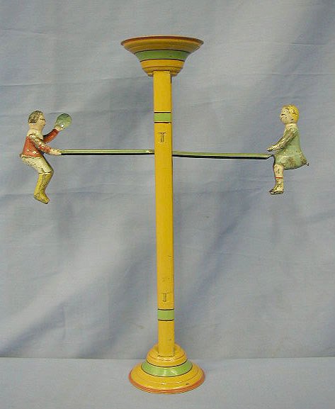 1102: 30's Gibbs tin see saw