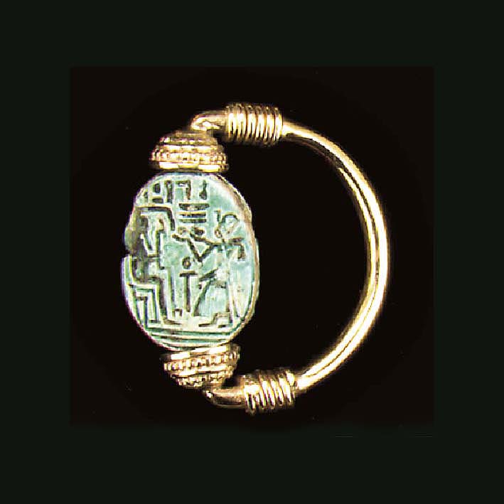AN EGYPTIAN FAIENCE SCARAB