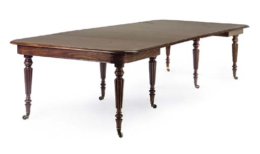 A REGENCY MAHOGANY EXTENDING DINING TABLE