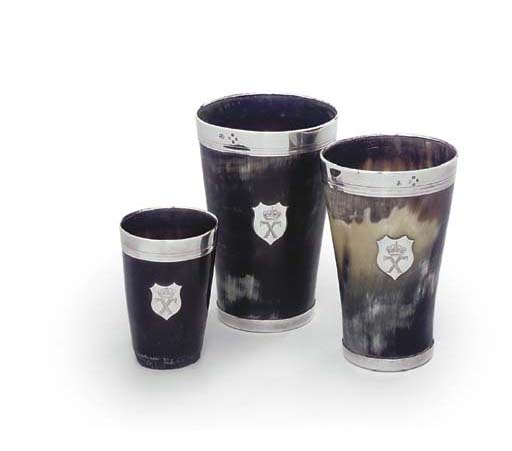 A SET OF THREE VICTORIAN SILVER-MOUNTED HORN BEAKERS
