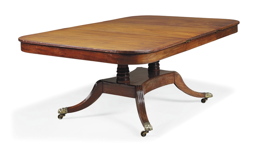 A REGENCY MAHOGANY EXTENDING DINING TABLE