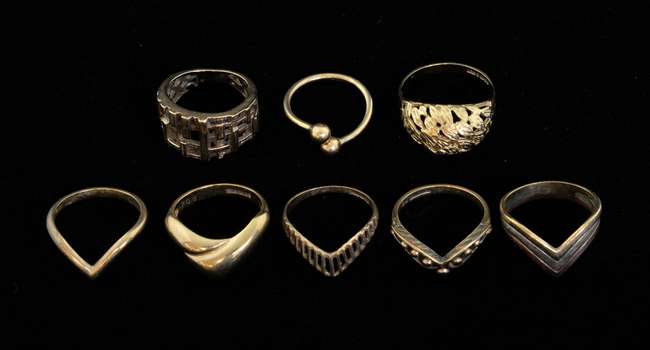 Eight gold or yellow metal rings