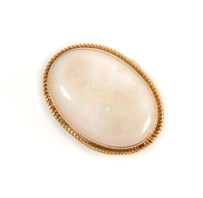 A 9ct gold oval opal cabochon set ring, the opal
