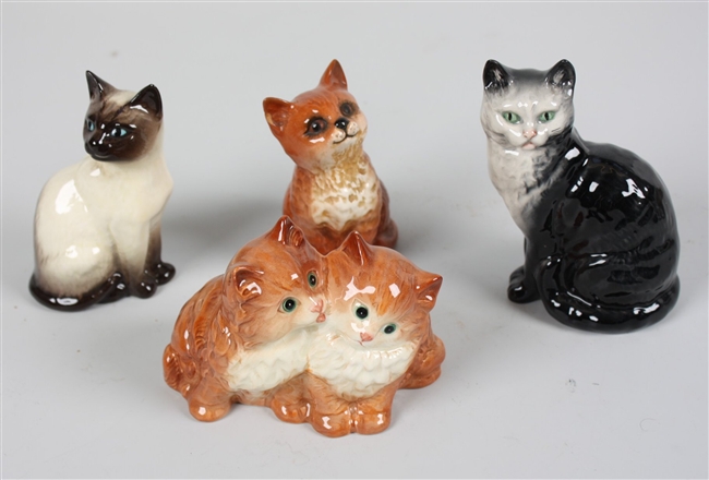 Four Beswick animal figures each modelled as cats