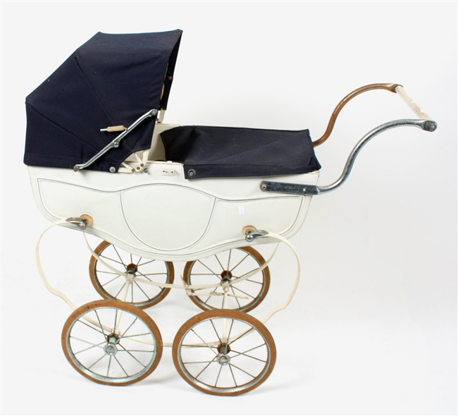 A Tri-ang dolls pram and other items.