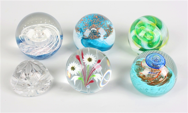 Four Caithness glass paperweights