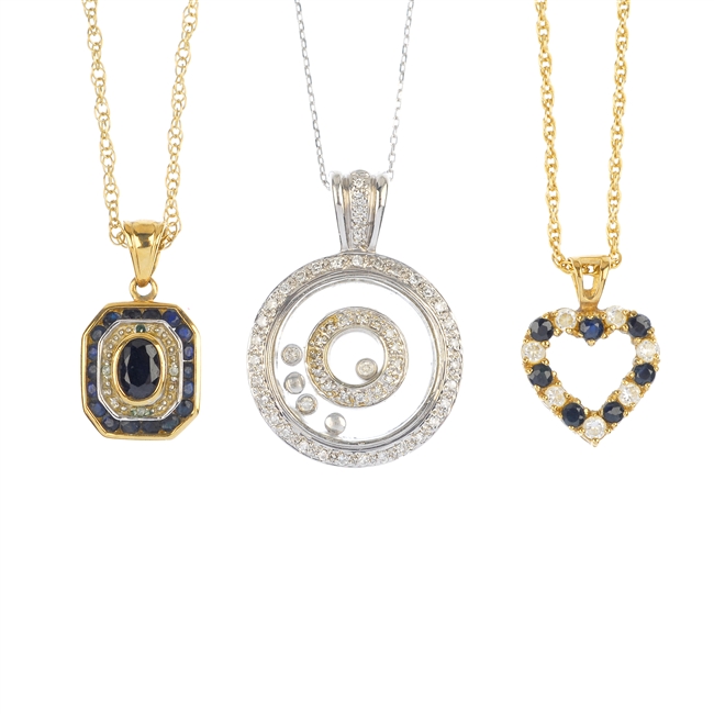 A selection of three 9ct gold gem-set pendants.