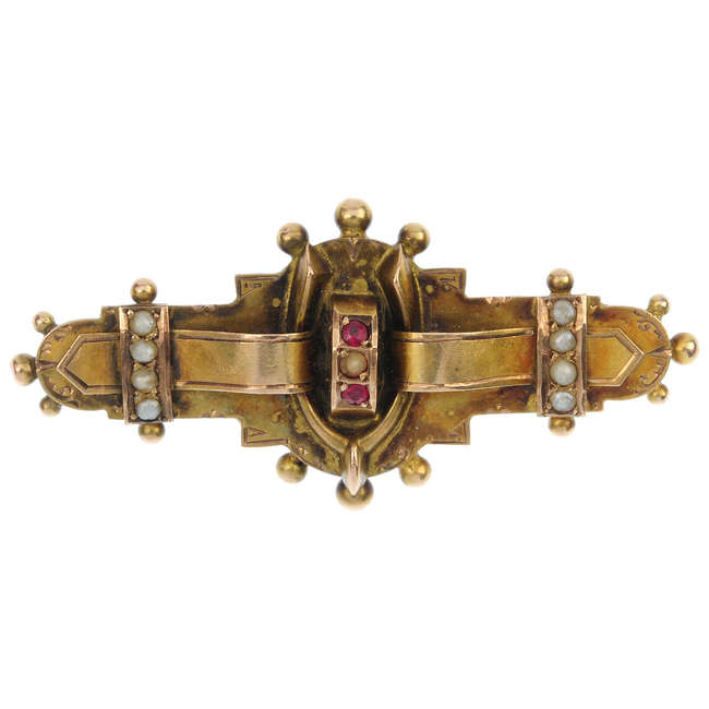 An Edwardian 9ct gold ruby and split pearl brooch.
