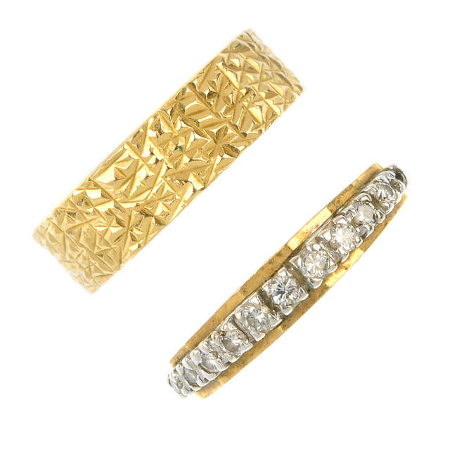 A diamond half-circle eternity ring and a band ring.