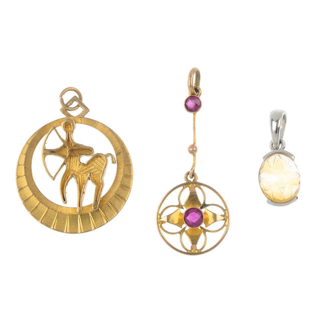A selection of three 9ct gold gem-set pendants.