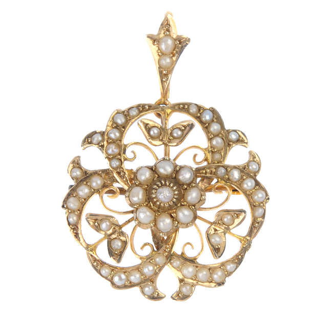 An Edwardian 9ct gold split pearl pendant.