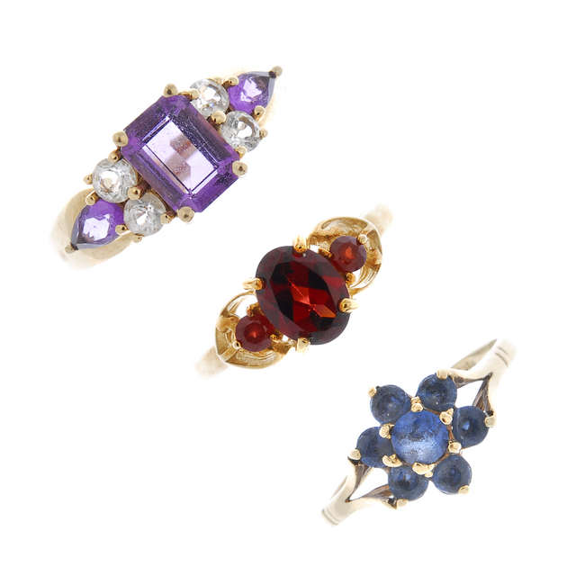 A selection of three 9ct gold gem-set rings.