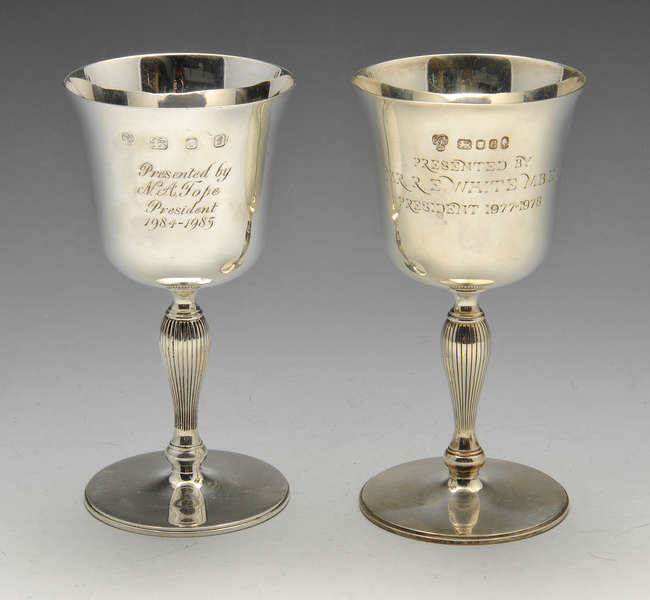 Three modern silver goblets.