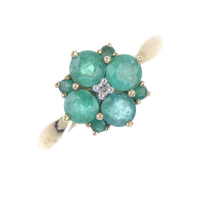 A 9ct gold emerald and diamond ring.