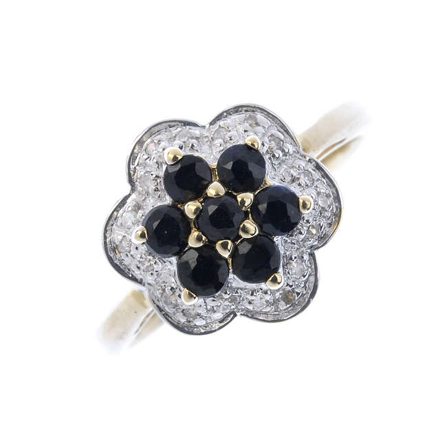 A 9ct gold sapphire and diamond cluster ring.