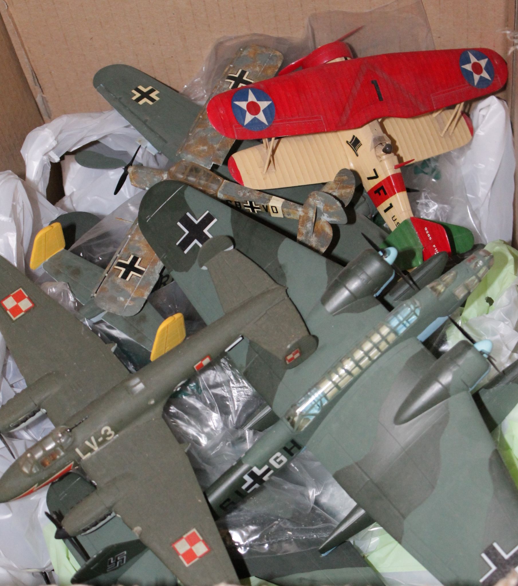 Assorted kit-built plastic model aircraft.