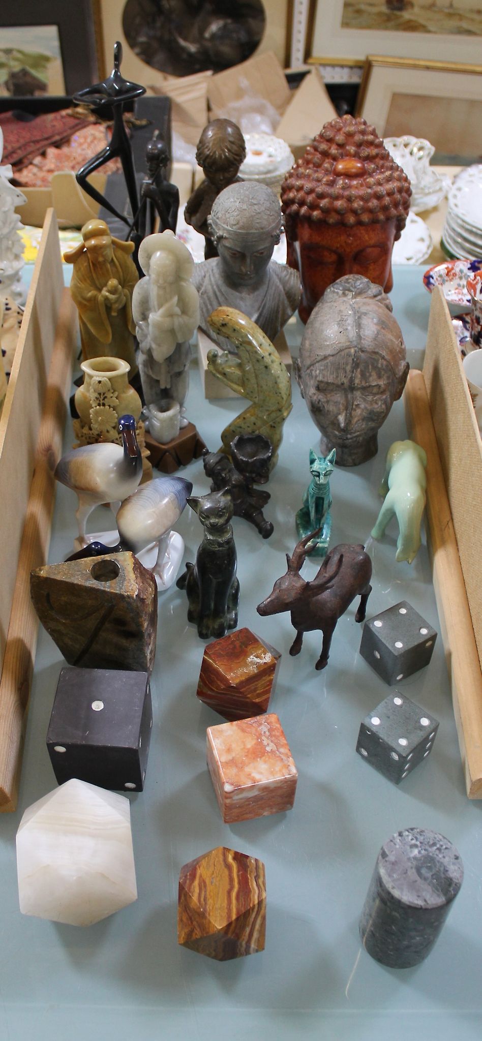 A mixed lot of decorative objects to include a resin Buddha head