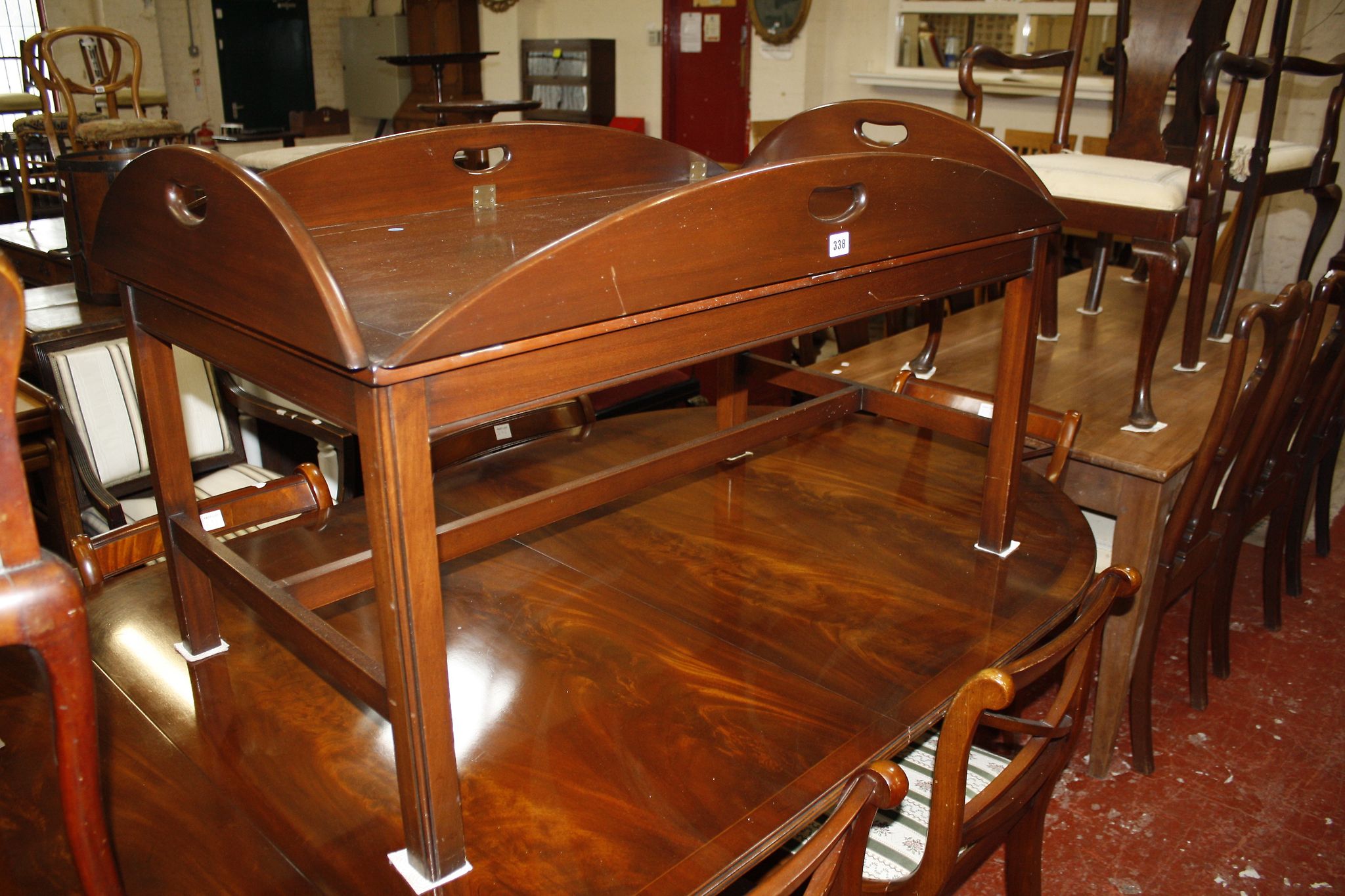 A George III style mahogany butlers tray style coffee table