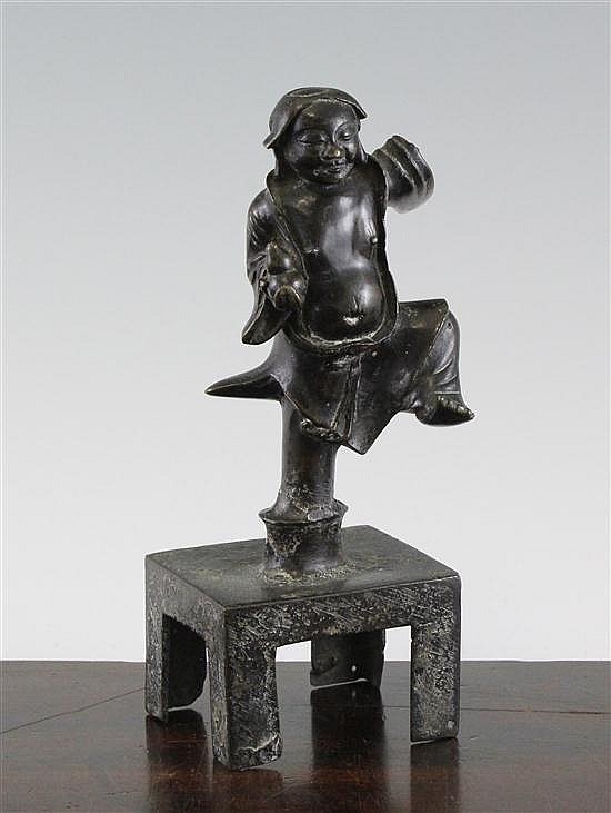 A Chinese bronze dancing figure of a man