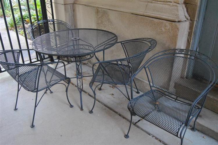 Five piece wrought iron patio set, table and four club chairs