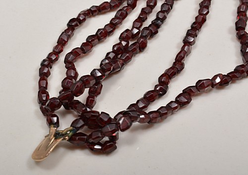 Six strand faceted garnet bead necklace