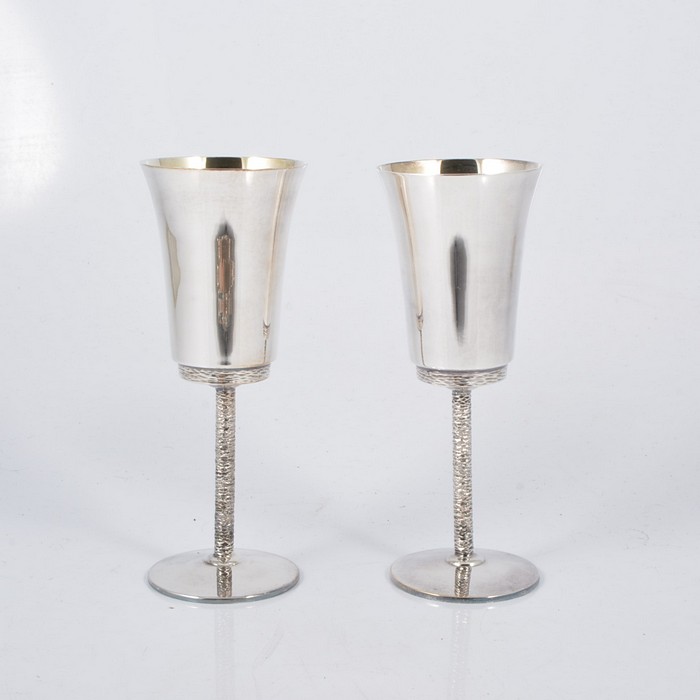 A set of eight silver wine goblets