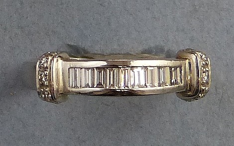 A diamond eternity ring, half hoop, the platinum band channel set with bagu