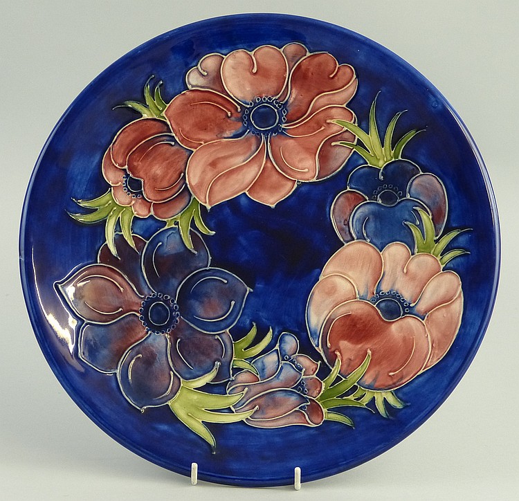 A Moorcroft charger, of circular form, tube lined in the "Anemone" pattern