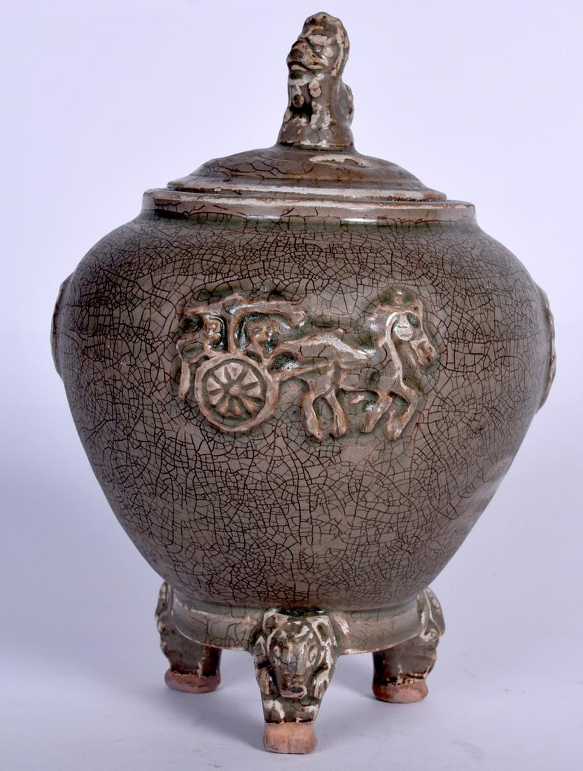 A CHINESE TRI LEGGED POTTERY CENSER, formed with foo