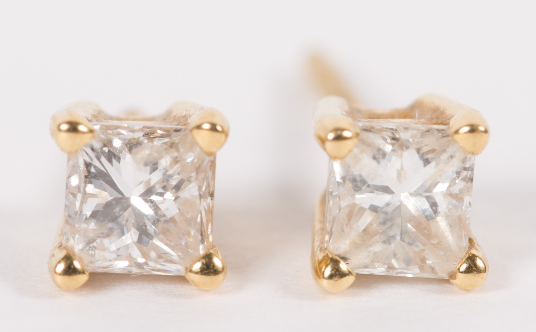 A Pair of Princess Cut Diamond Stud Earrings
