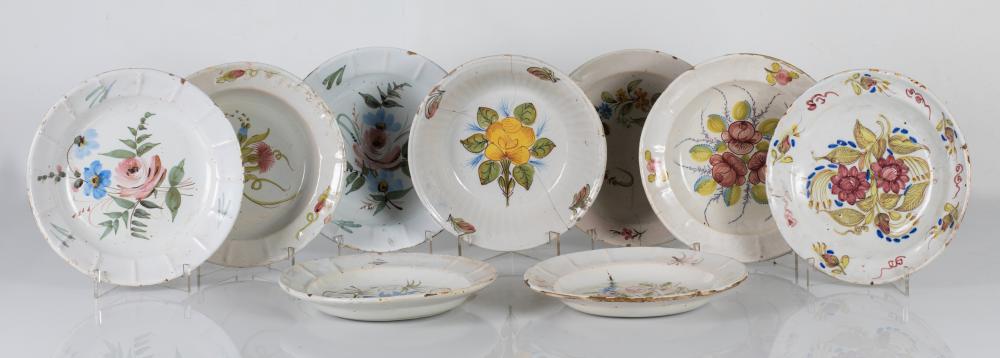 Eight plates and a glazed ceramic basin