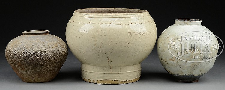 THREE POTTERY STORAGE JARS.