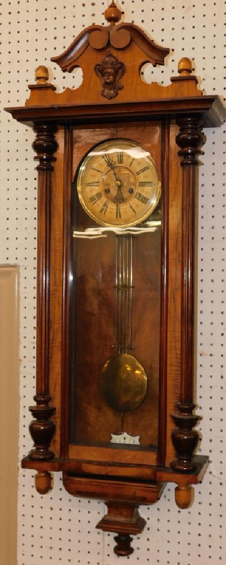 Walnut Viennese regulator clock. 52" long.