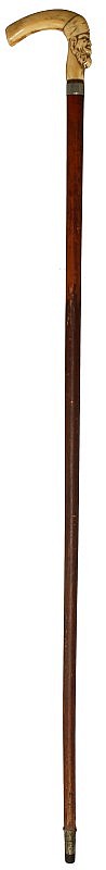 WOODEN WALKING STICK WITH CARVED BONE HANDLE