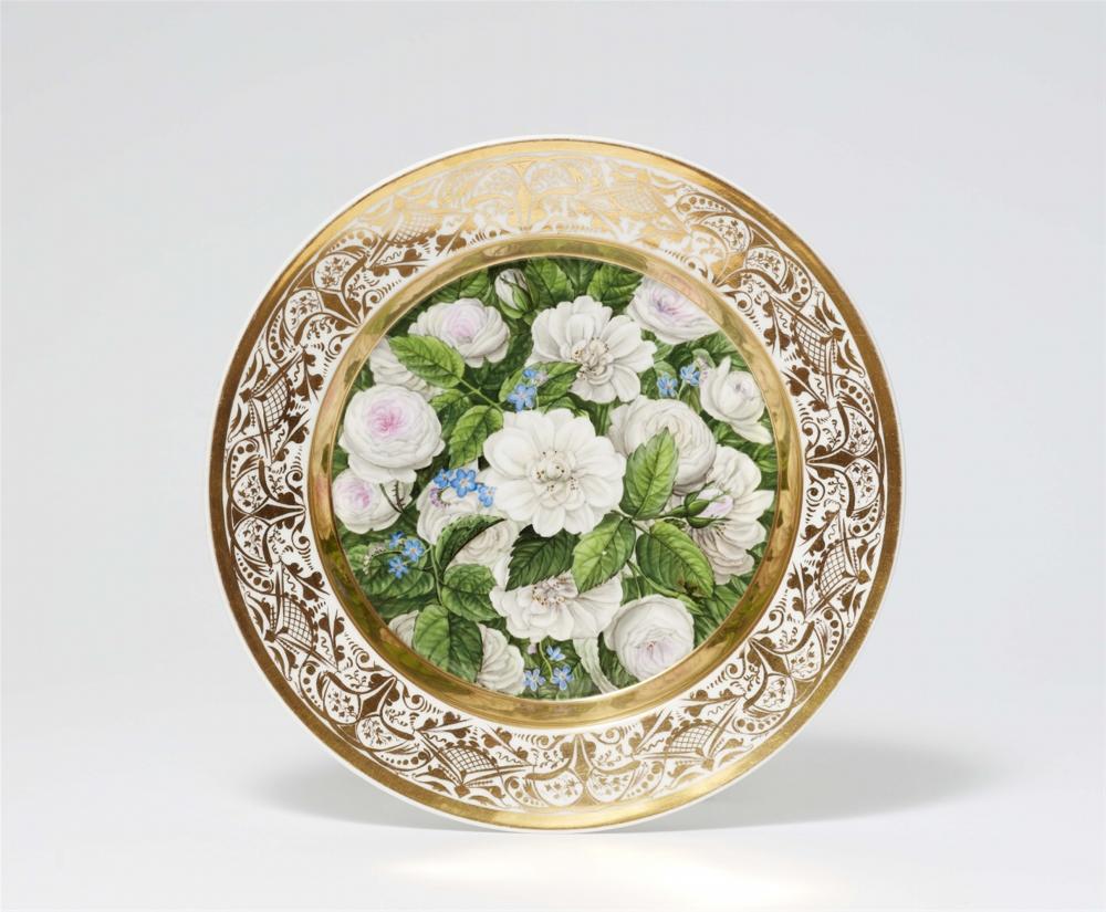A Berlin KPM botanical porcelain plate with dog roses