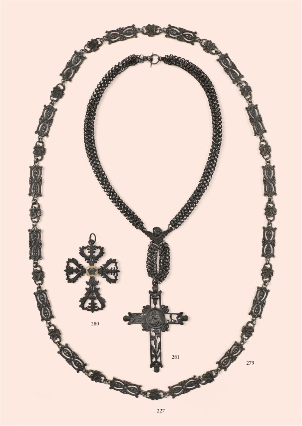 A cast iron necklace with a cross pendant