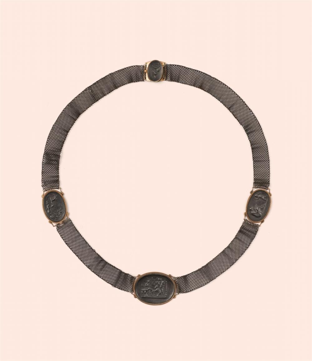 A woven cast iron necklace with cameos