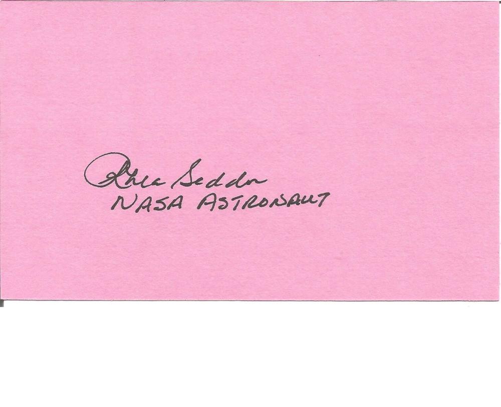 NASA Astronaut Rhea Seddon signed pink card. Good Condition. All signed pieces come with a