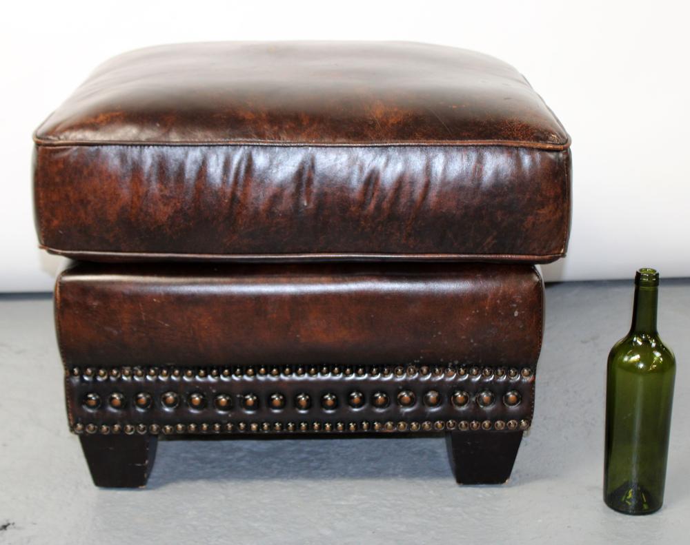 Leather ottoman with nailhead trim