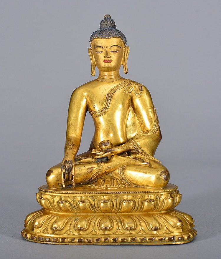 A GILT BRONZE FIGURE OF SAKYAMUNI