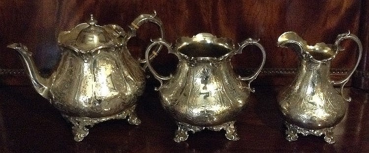 A VICTORIAN THREE PIECE HALLMARKED SILVER TEA SERVICE