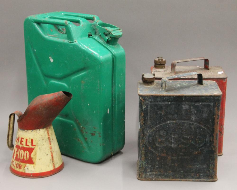 A Shell Oil can and petrol cans.